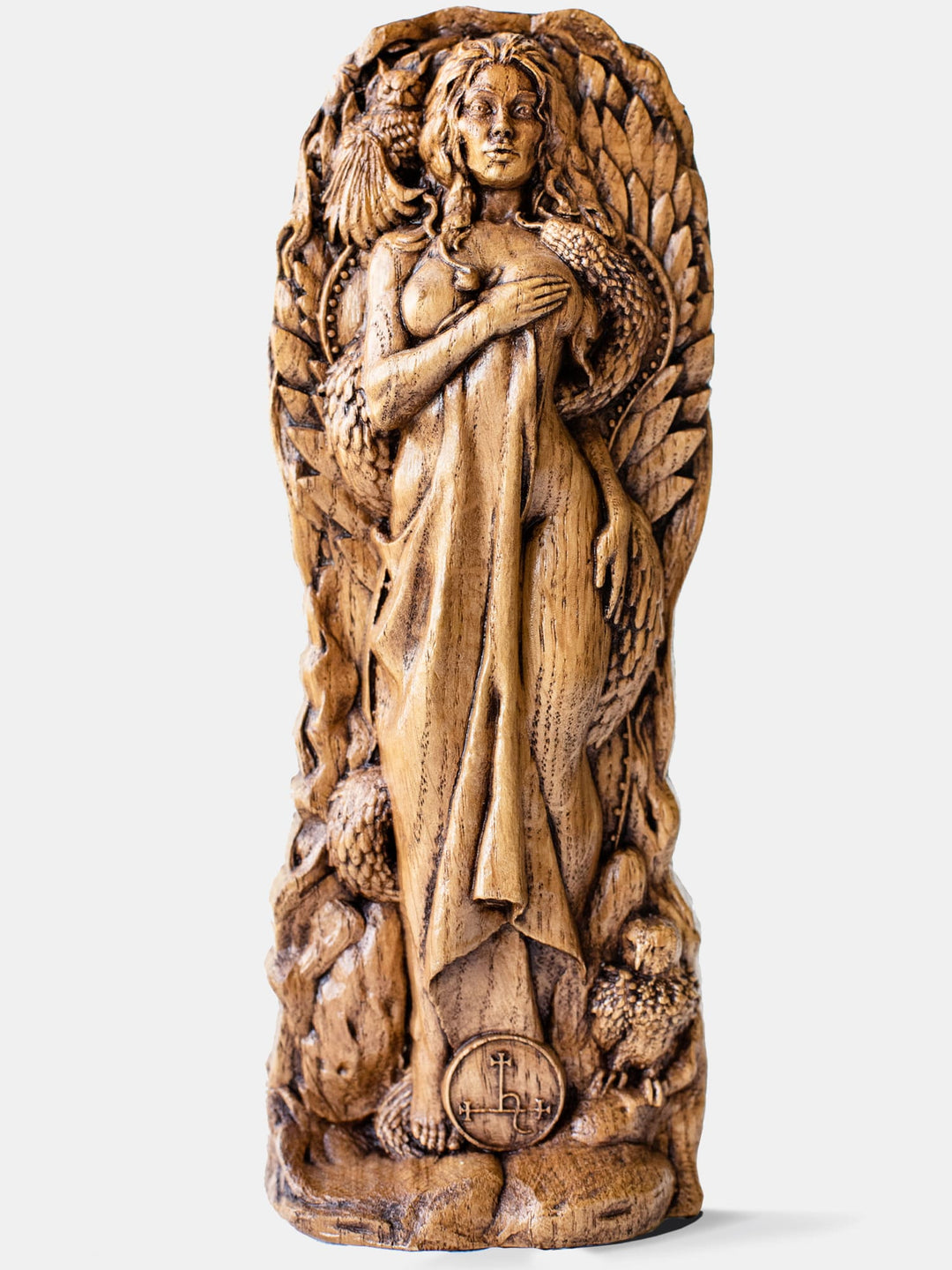 Close-up of the handcrafted oak Lilith statue, showcasing the half-naked goddess with an owl and snake nearby.