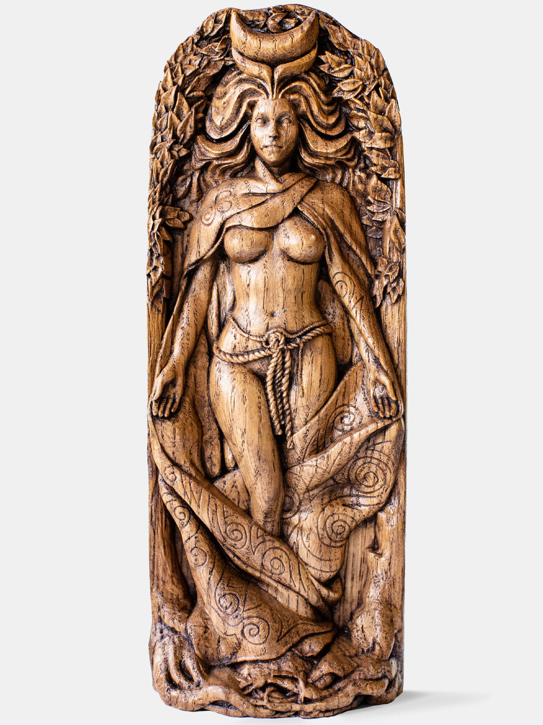 Close-up of the handcrafted oak Moon Goddess statue, showcasing the half-naked goddess standing among trees with the moon on her forehead.