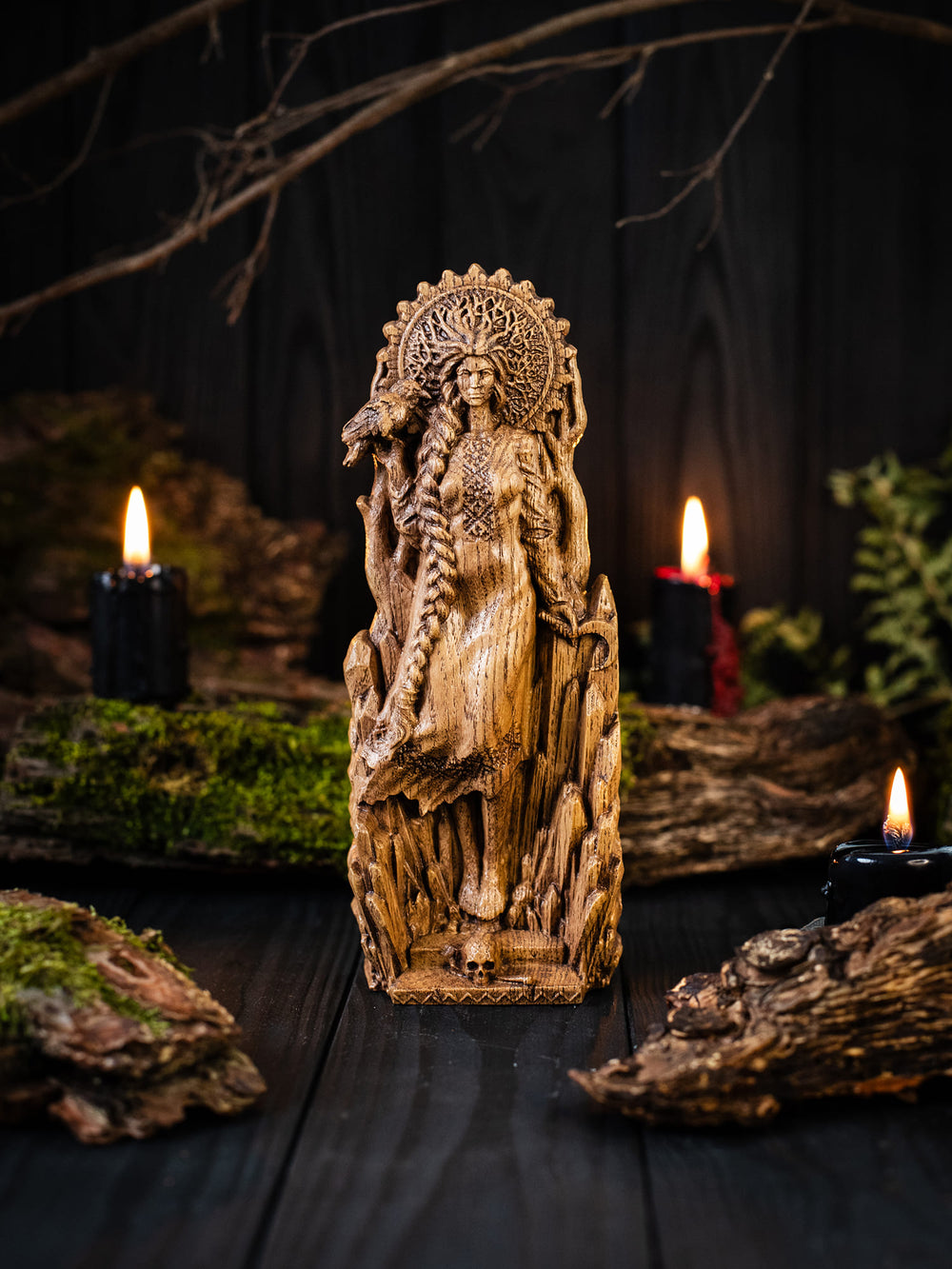 Full view of the Morana statue from the front, highlighting its dimensions and intricate design with large ice crystals and bare winter trees behind her.