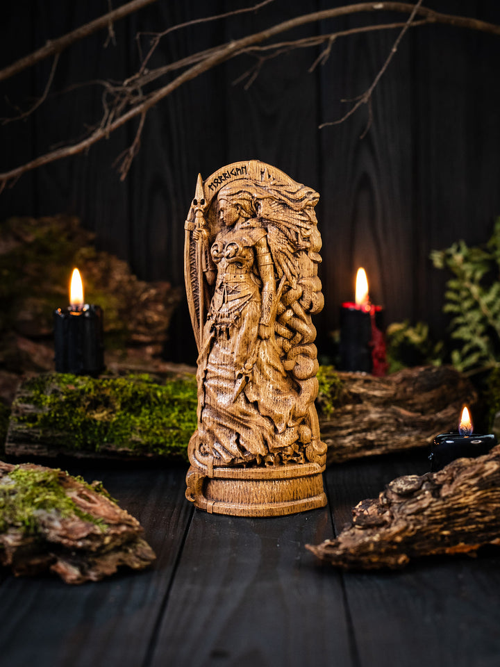Full view of the Morrigan statue from the front, highlighting its dimensions and intricate design with skulls at her feet symbolizing the fallen warriors.