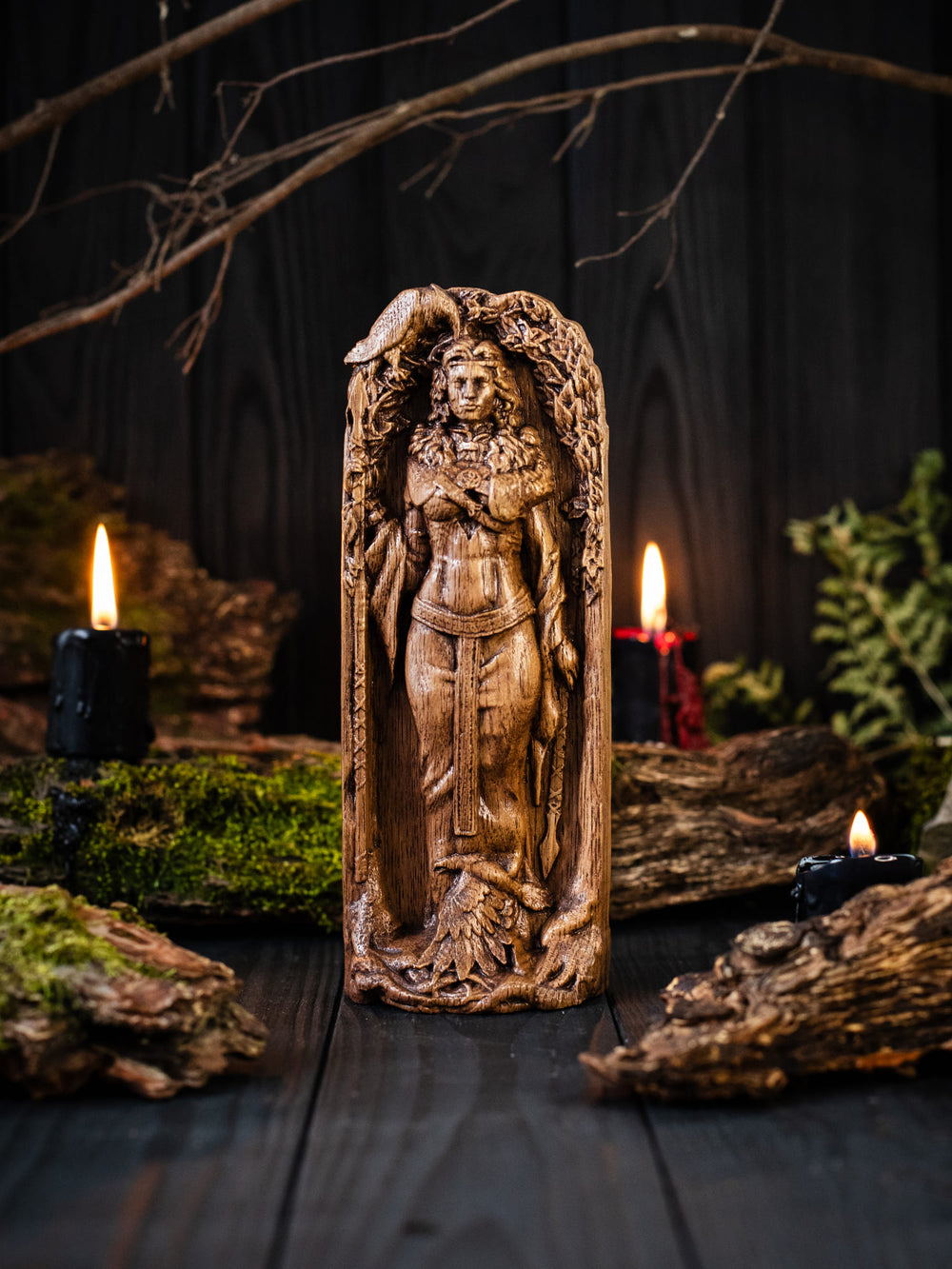 Full view of the Morrigan statue from the front, highlighting its dimensions and intricate design with skulls at her feet symbolizing the fallen warriors.
