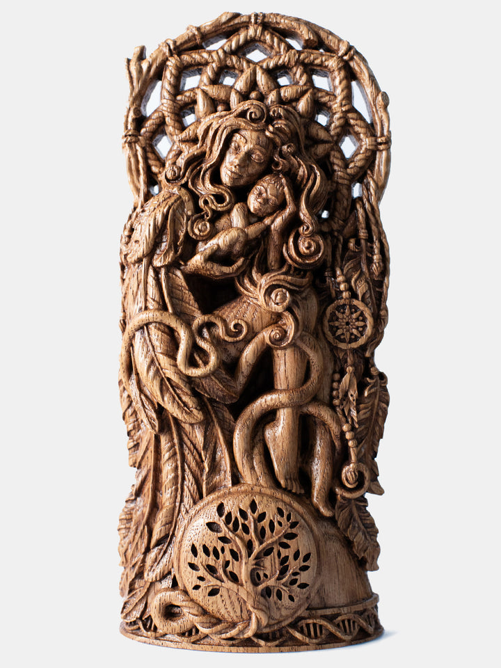 Handcrafted wooden Mother Fertility Goddess statue holding child, with wings, umbilical cord to Tree of Life, and dreamcatcher.
