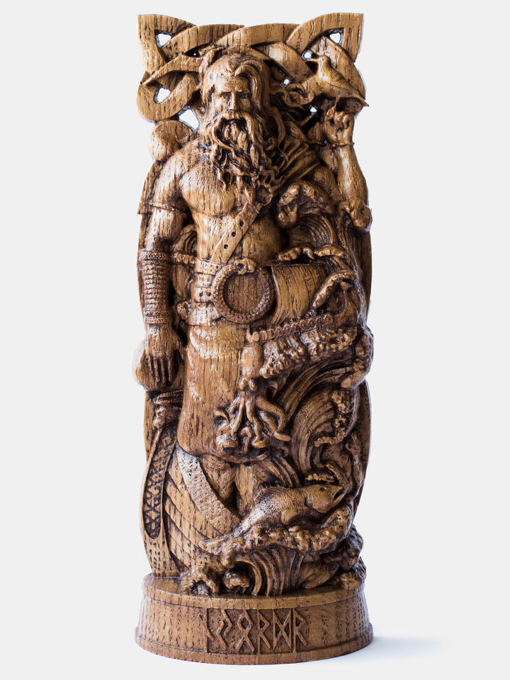 Close-up of the handcrafted oak Njord statue, showcasing the Norse Sea God standing in a boat with a seagull on his hand.