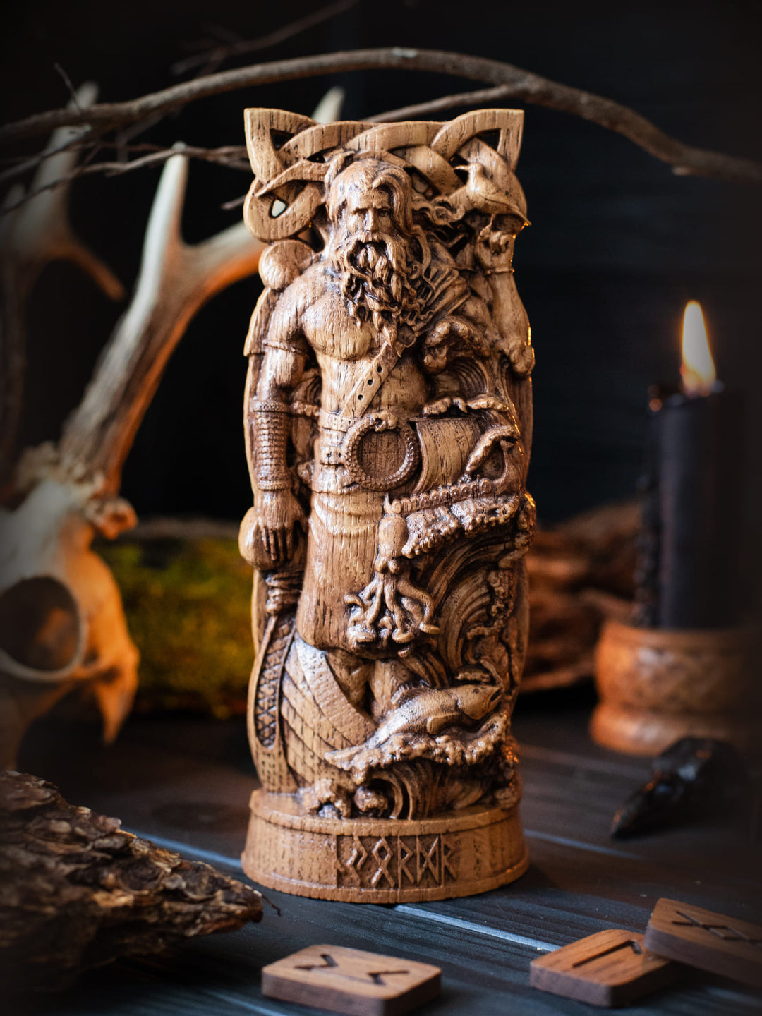Full view of the Njord statue from the front, highlighting its dimensions and intricate design with a sea wave, sea animals, and drakkars.