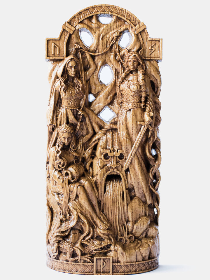 Close-up of the handcrafted oak Three Norns statue, showcasing the goddesses weaving fate at the roots of Yggdrasil.