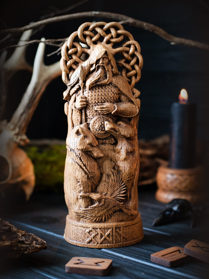 Full view of the Odin statue from the front, highlighting its dimensions and intricate design with spear, ravens, and wolves.