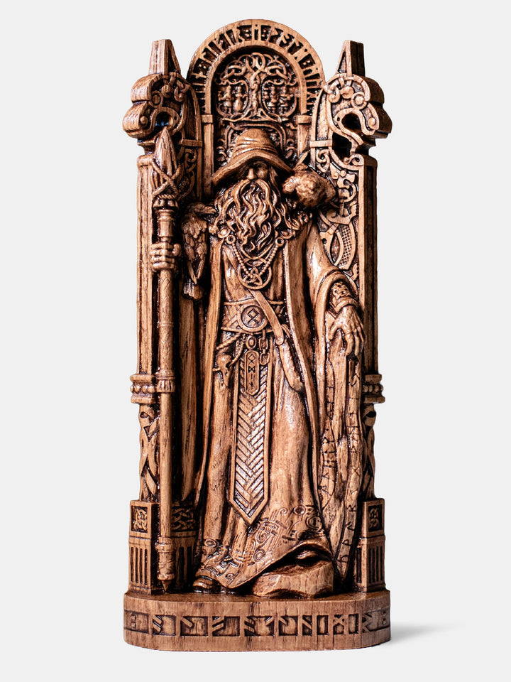 Handcrafted Odin statue as wandering Allfather with spear, runestone, ravens, and Norse carved wolf columns.