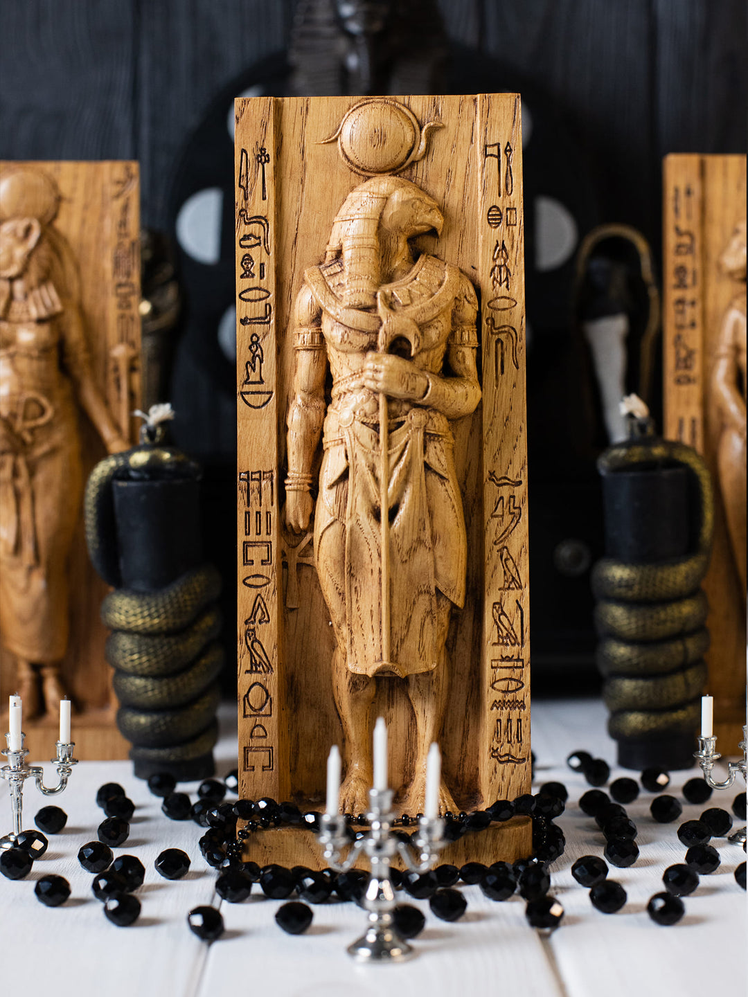 Full view of the Ra statue from the front, highlighting its dimensions and intricate design featuring traditional regalia and the falcon head.