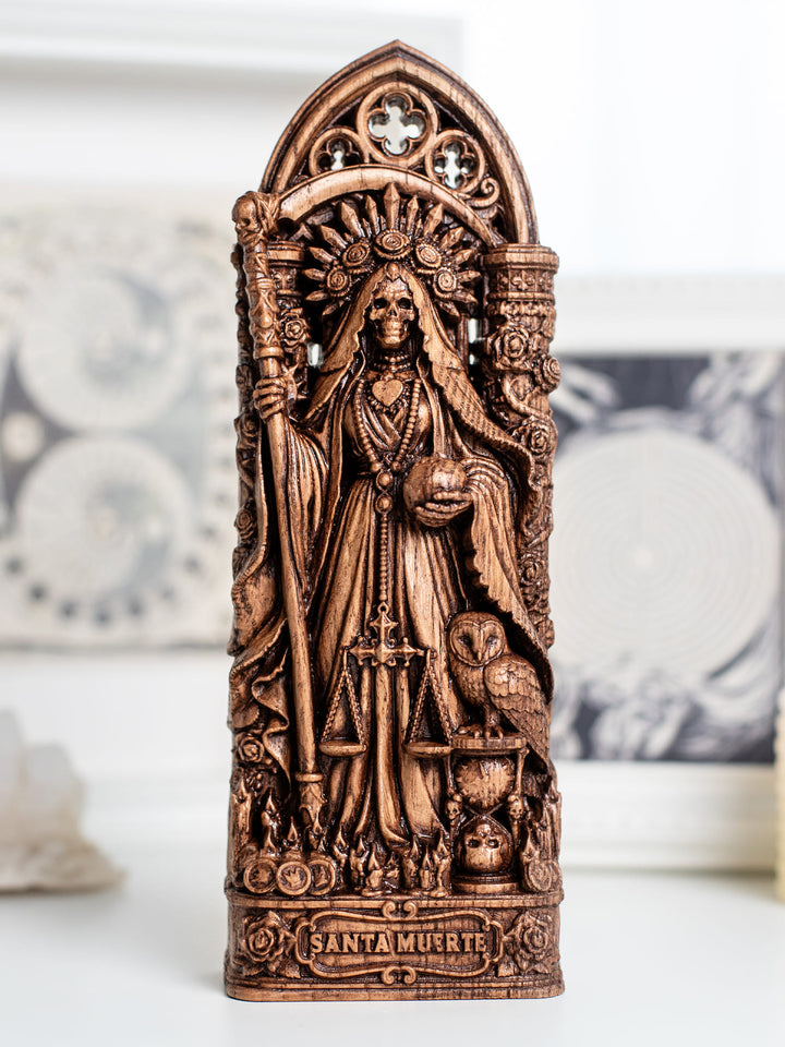 Wooden Santa Muerte statue with antique patina for Mexican folk spirituality, dark altar decor, and memento mori symbolism.