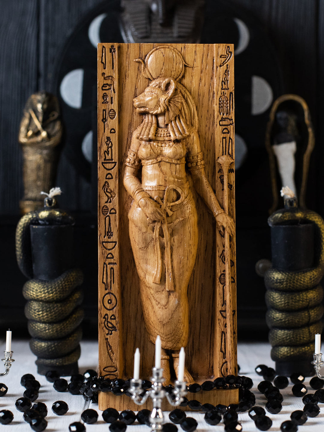 Full view of the Sekhmet statue from the front, highlighting its dimensions and intricate design featuring traditional Egyptian attire and symbols.