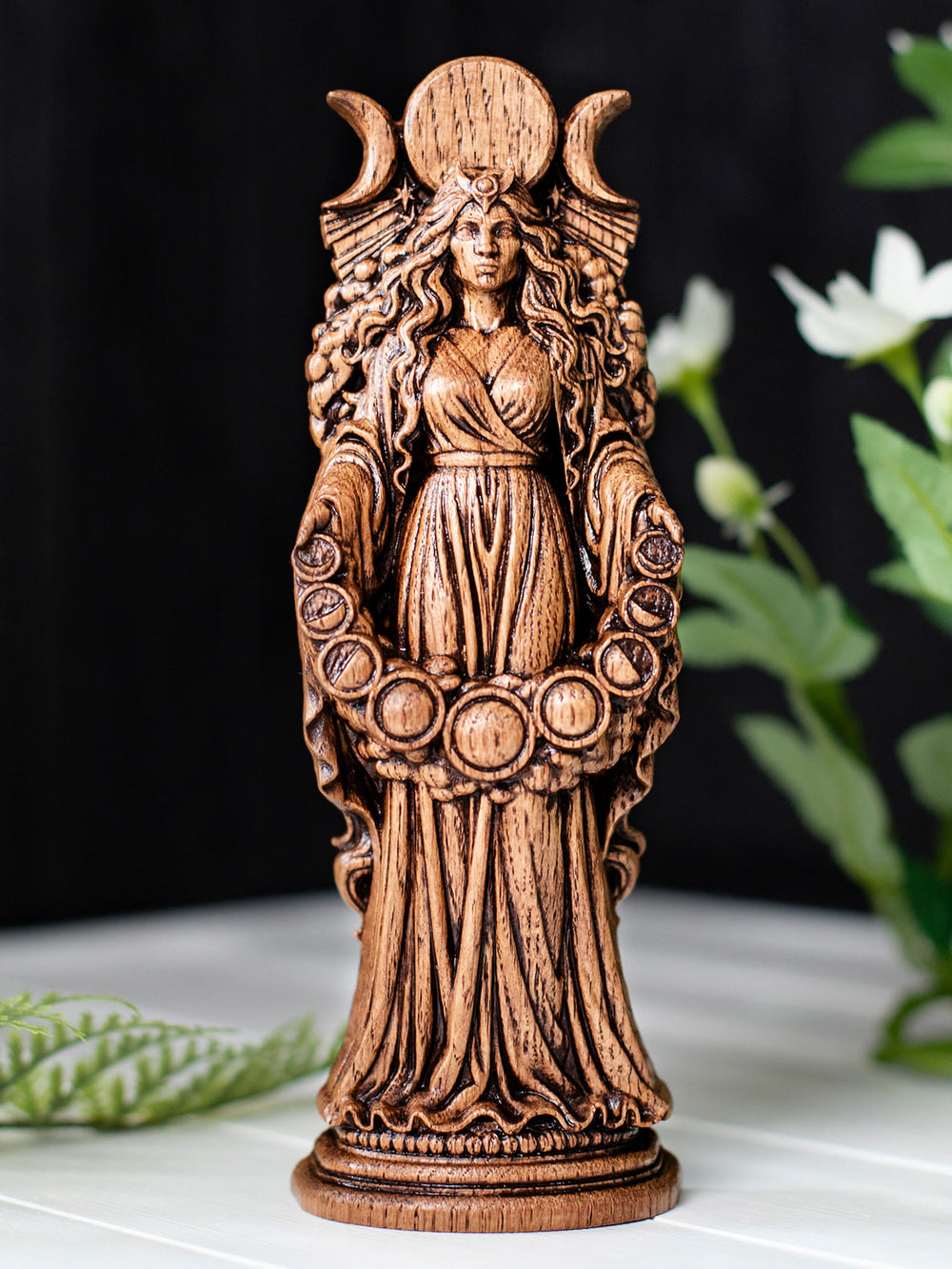 Wooden moon goddess Selene figurine showing lunar phases, star beams, and night sky cloud detailing.