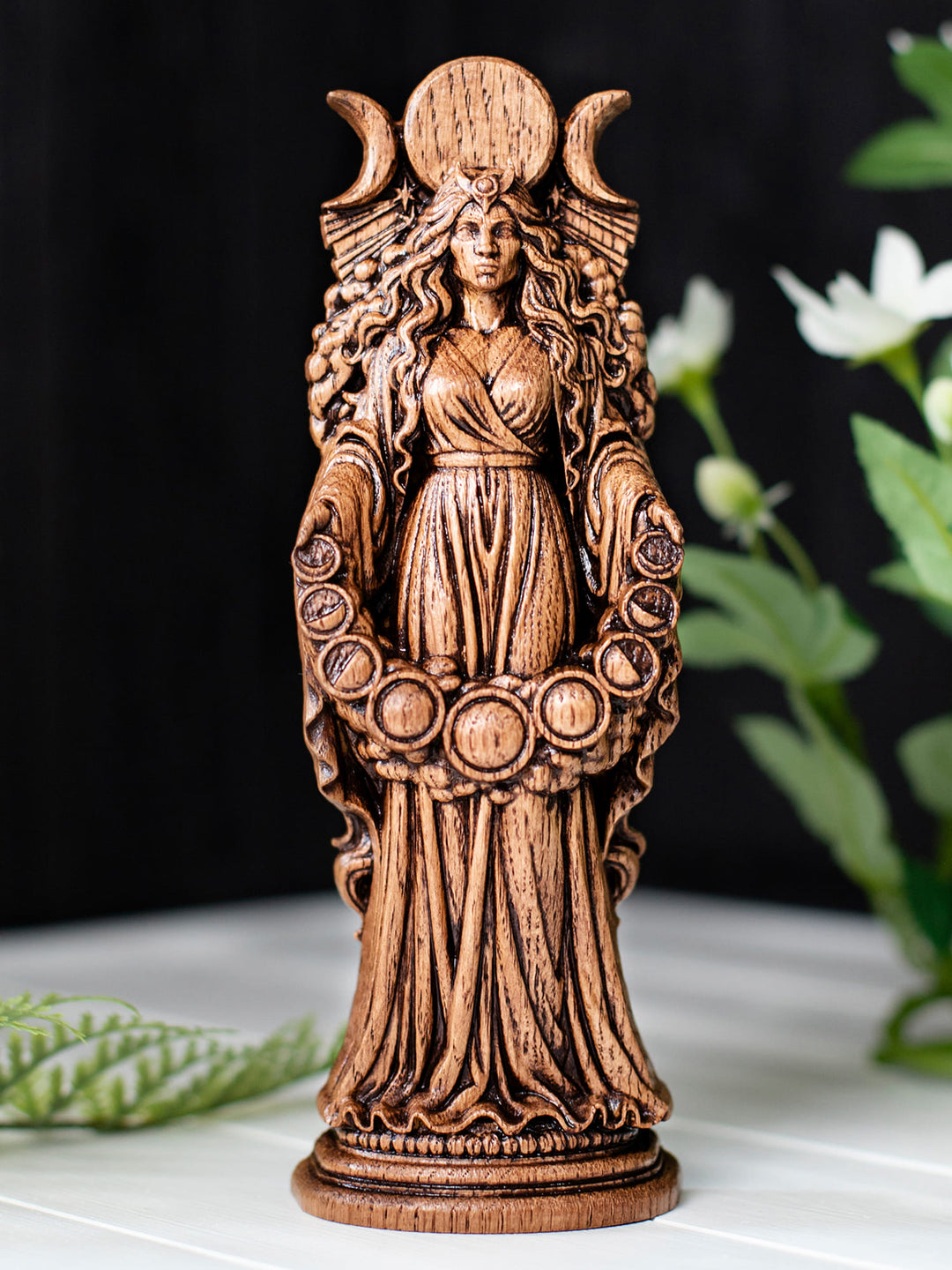 Wooden moon goddess Selene figurine showing lunar phases, star beams, and night sky cloud detailing.