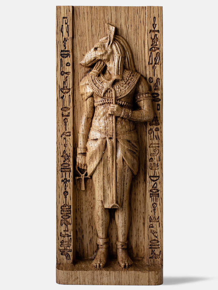 Close-up of the handcrafted oak Set statue, showcasing the Egyptian God of Chaos with his unique head and traditional Egyptian attire.