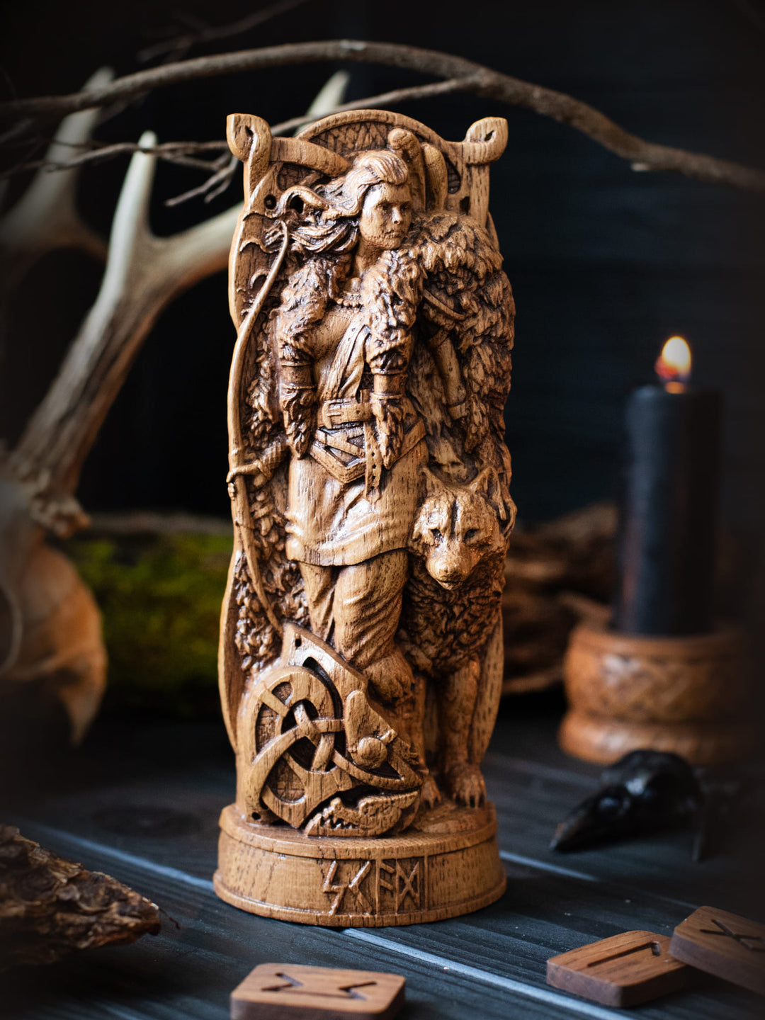 Full view of the Skadi statue from the front, highlighting its dimensions and intricate design with skis seen behind her.