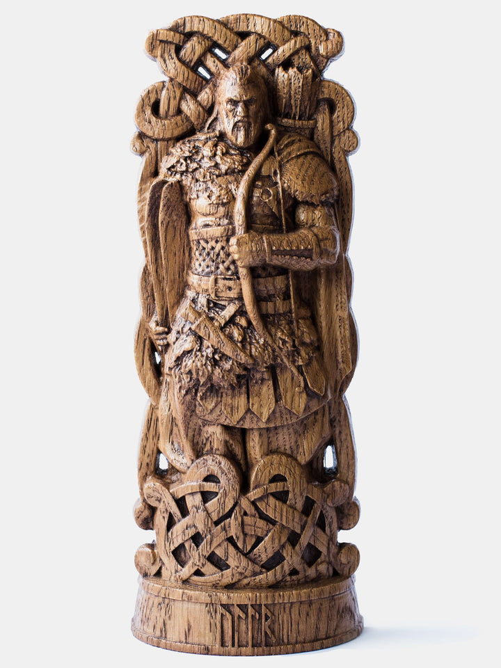 Close-up of the handcrafted oak Ullr statue, showcasing the Norse God of Winter holding a bow and skis, as depicted in the lore of the Edda.