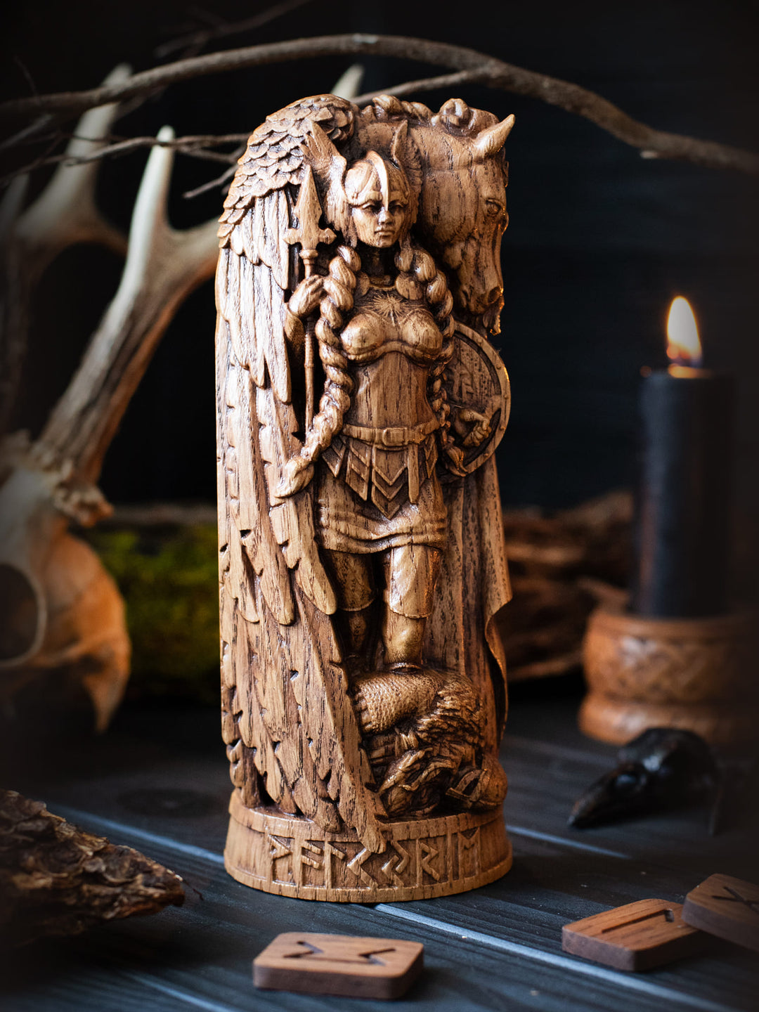 Full view of the Valkyrie statue from the front, highlighting its dimensions and intricate design with a fallen warrior at her feet.