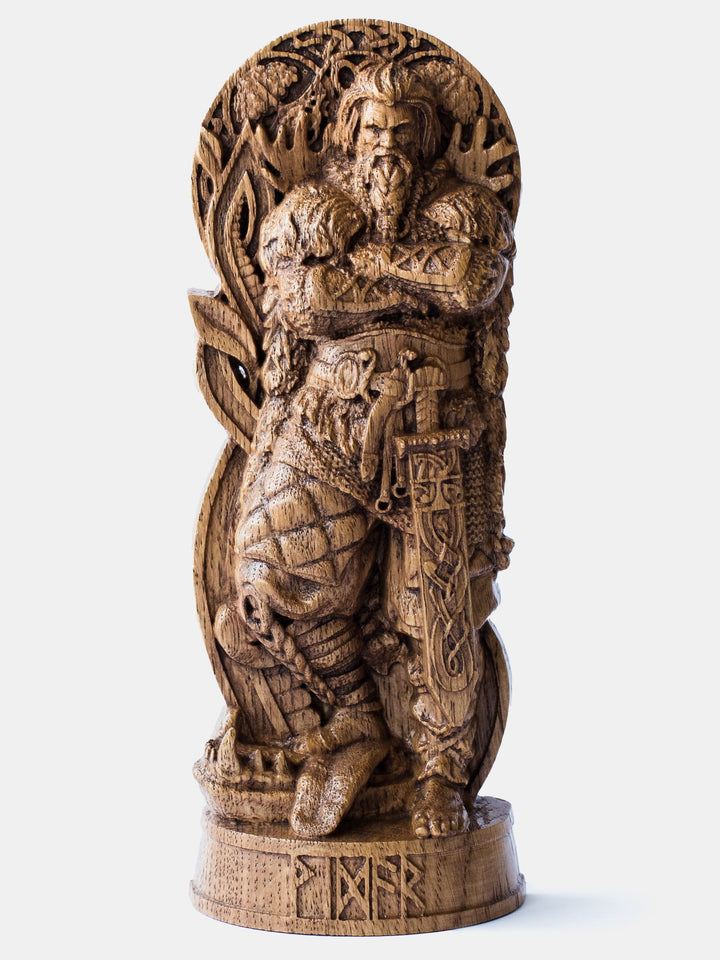 Close-up of the handcrafted oak Vidar statue, showcasing the Norse God of Vengeance with his magical shoe on Fenrir's torn cheek.