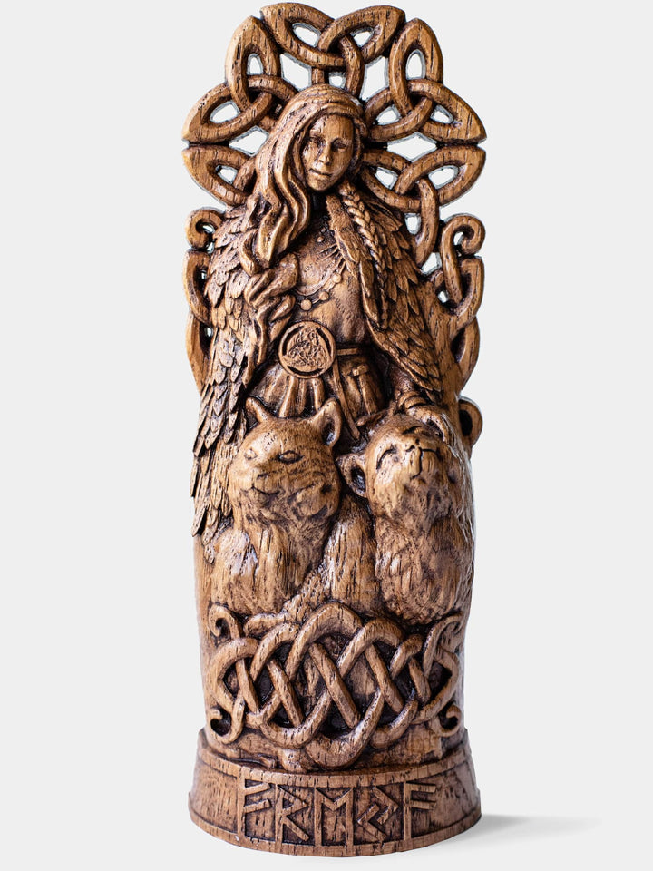 Close-up of the handcrafted oak Freya statue, showcasing detailed carvings of Freya with her cats.