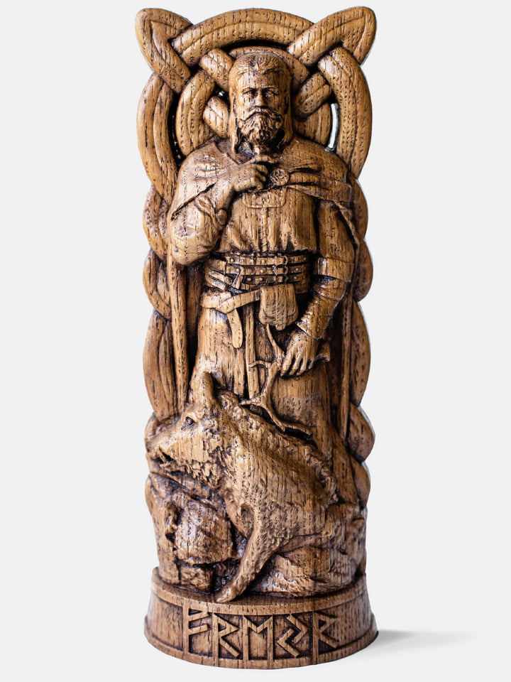 Close-up of the handcrafted oak Freyr statue, showcasing detailed carvings of Freyr with his sacred boar, Gullinbursti, and a horn in his hand.